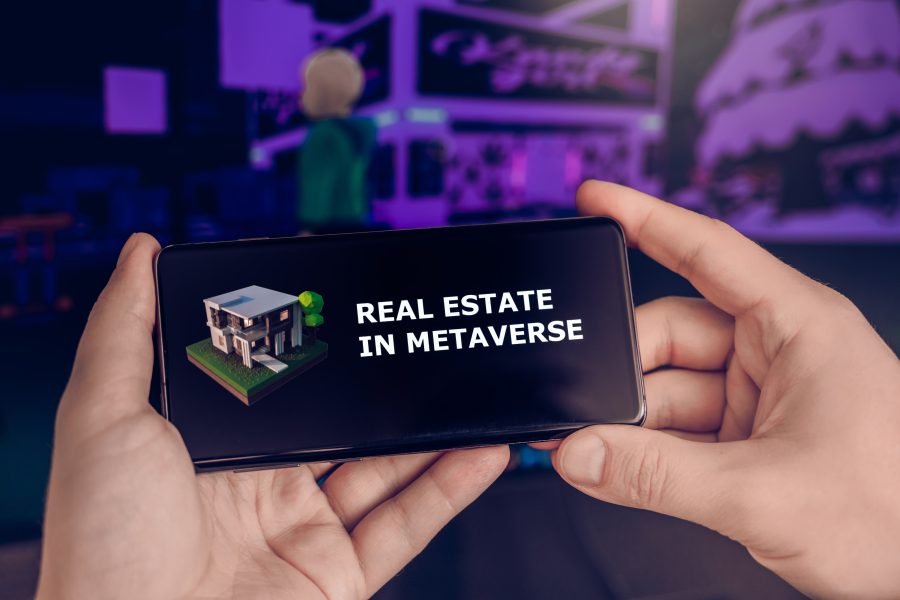A phone with the text Real Estate In Metaverse on it
