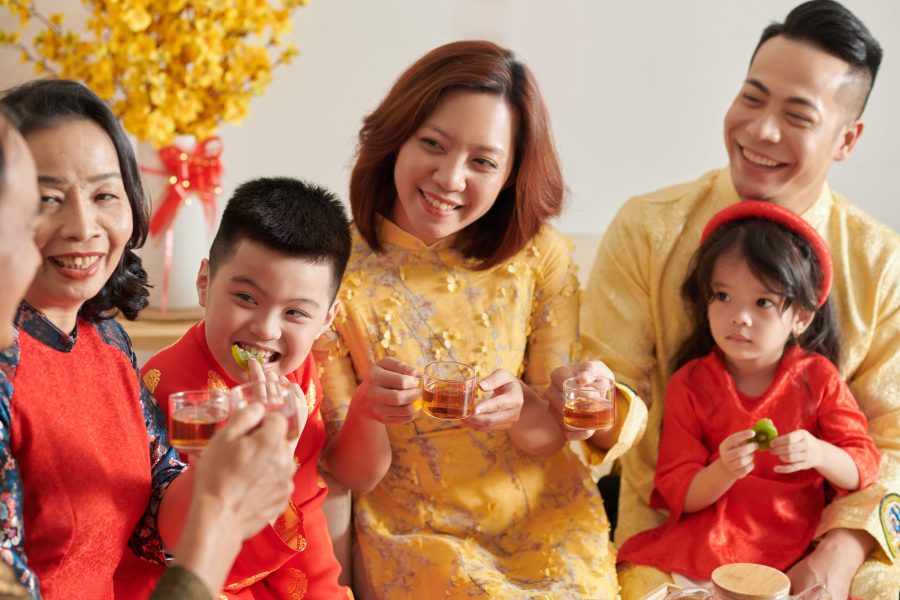 A family at a Lunar New Year party with traditional clothes