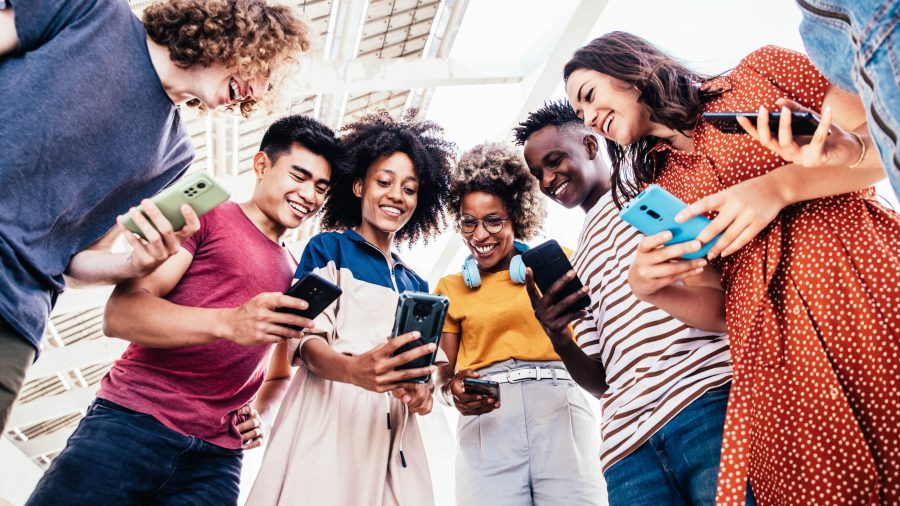diverse teenage students using digital smart mobil 2022 12 17 03 38 21 utc min