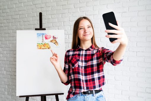 beautiful teenage girl taking selfie with her artw 2023 11 27 05 02 21 utc 1